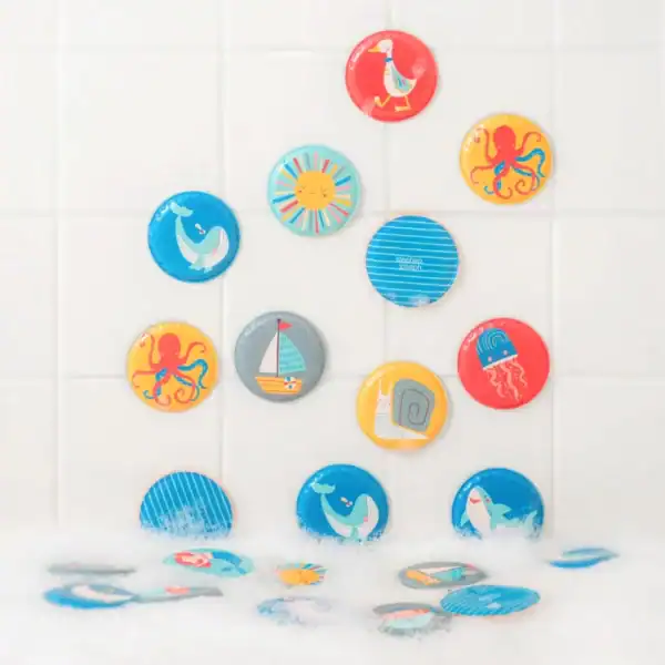 Colorful circular bath toys with animal designs.