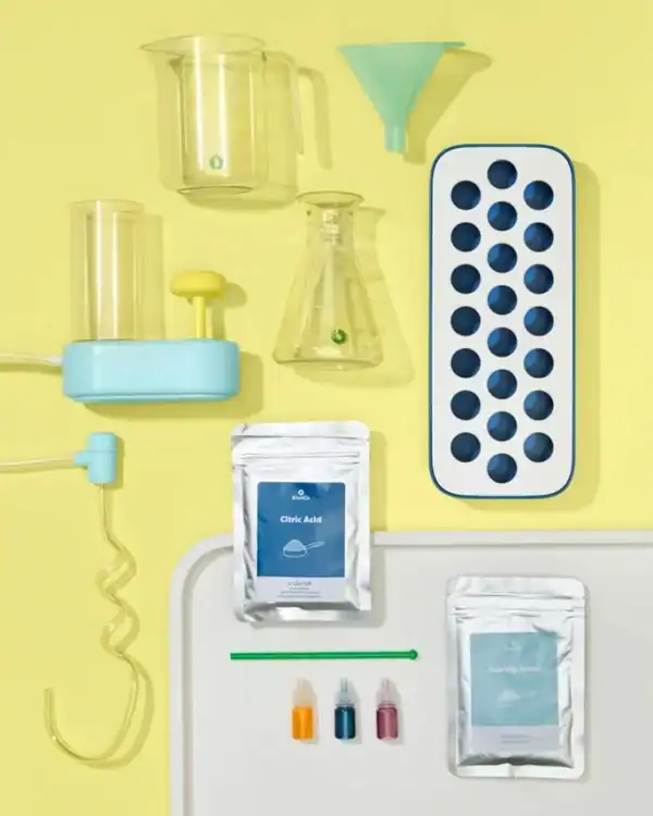 Science experiment kit with lab equipment and chemicals.