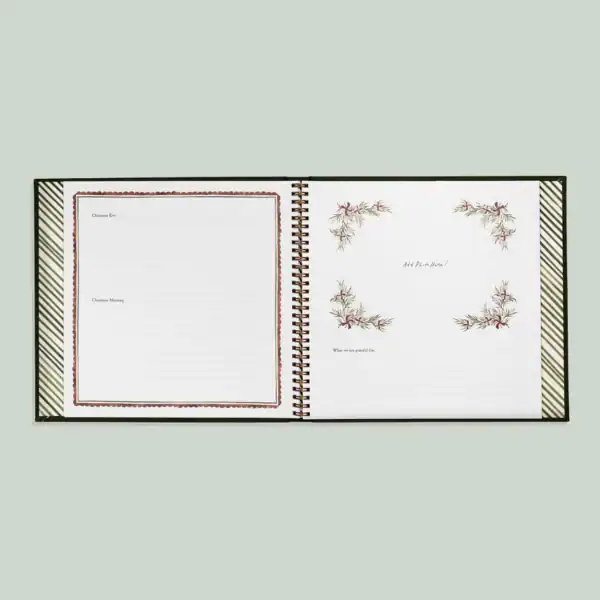 Open notebook with Christmas-themed pages