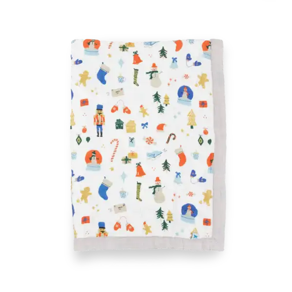 Colorful holiday-themed baby blanket with festive patterns.