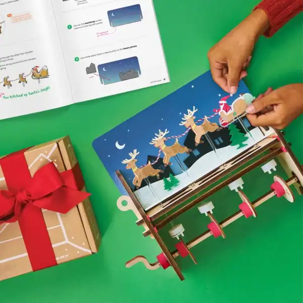Building Santa's sleigh with reindeer craft kit.