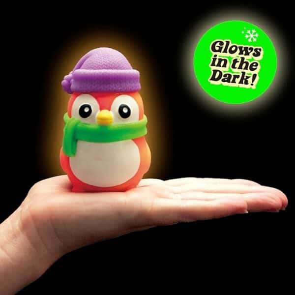 Glowing penguin toy on hand