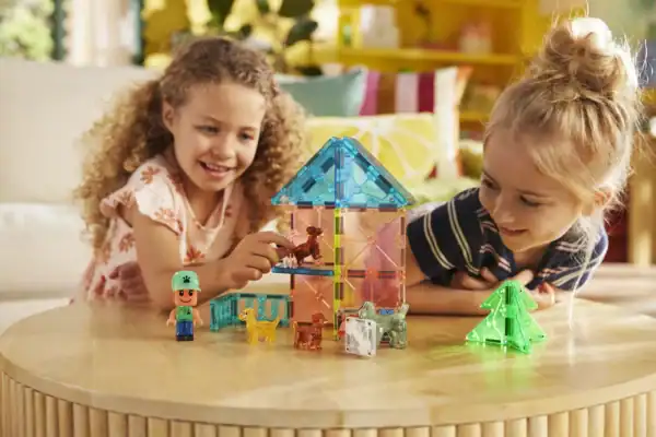 Kids playing with colorful toy building blocks.