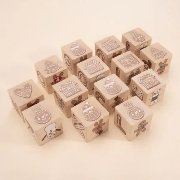 Wooden blocks with Christmas-themed designs.