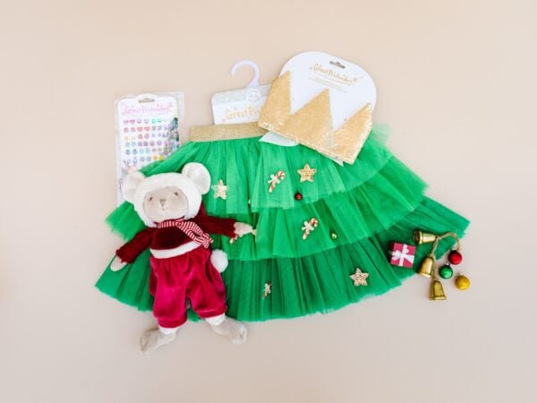 Christmas-themed doll outfit with green skirt and accessories.
