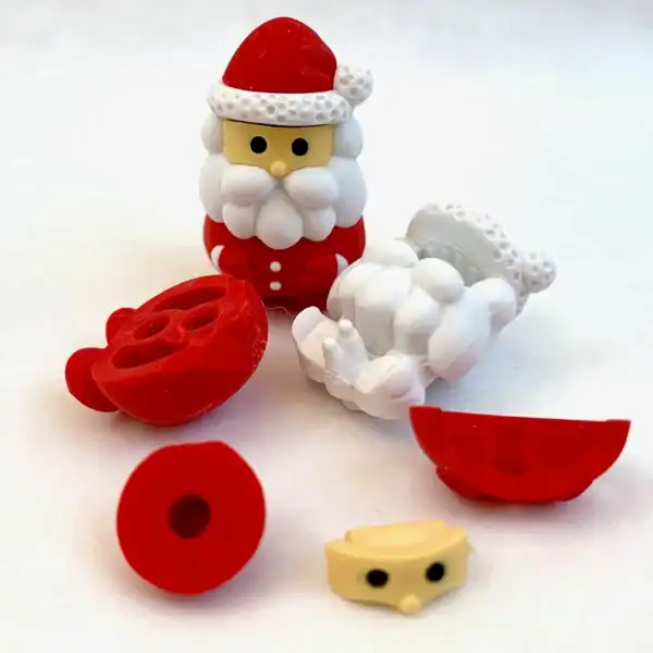 Disassembled Santa figure parts on a white background.