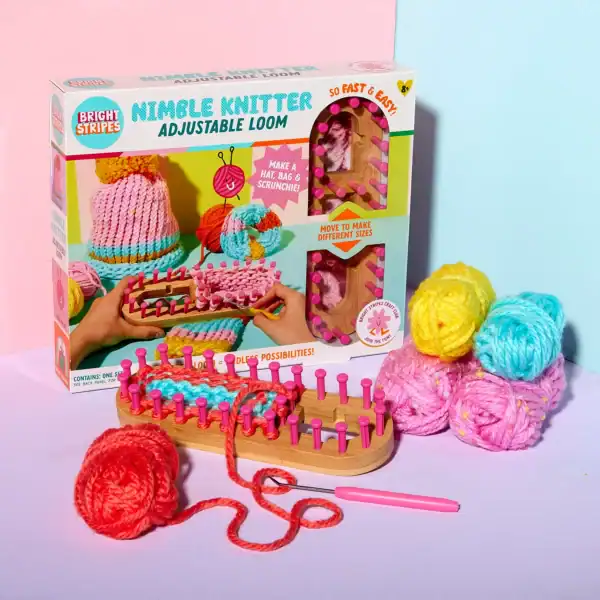 Nimble Knitter adjustable loom with colorful yarn.