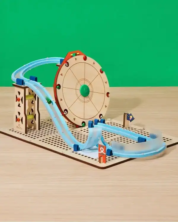 Wooden roller coaster toy set on table.