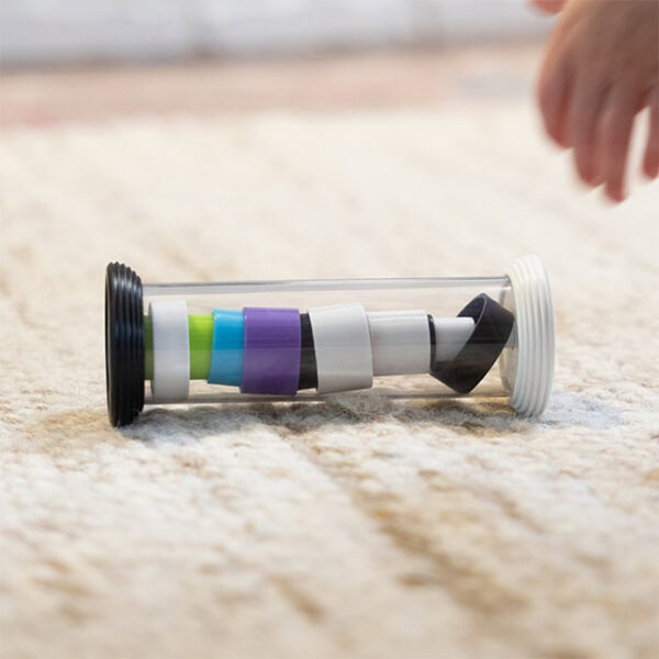 Baby toy with colorful rings on carpet