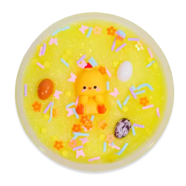 Yellow slime with colorful sprinkles and cute figurine.