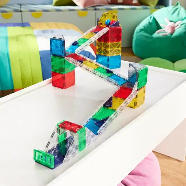 Colorful magnetic block structure on white table.