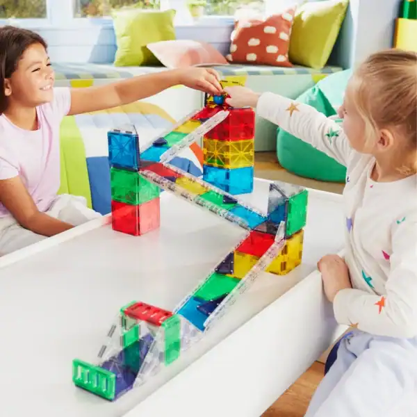 Children playing with colorful magnetic tiles