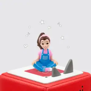 Figurine on speaker with musical notes and stars.