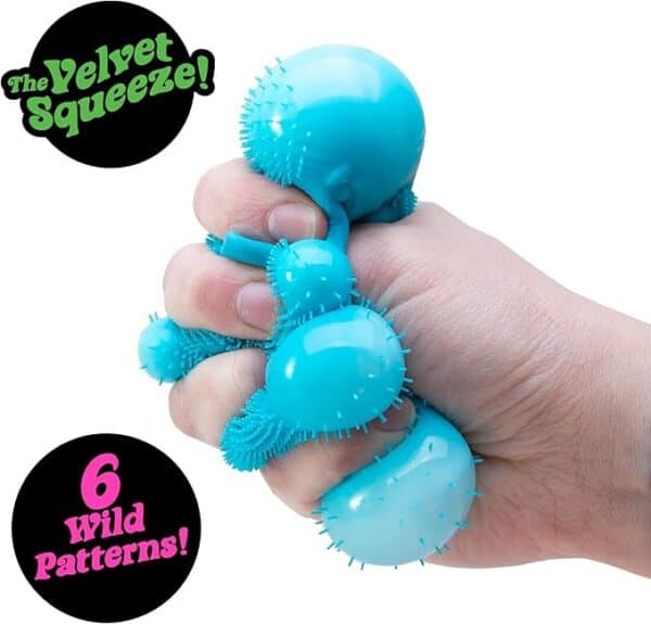 Hand squeezing blue spiky stress ball toy