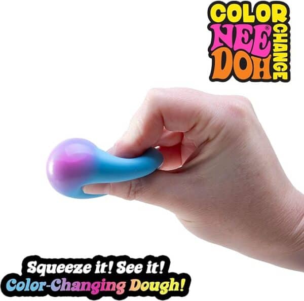 Hand squishing color-changing Nee Doh stress ball.