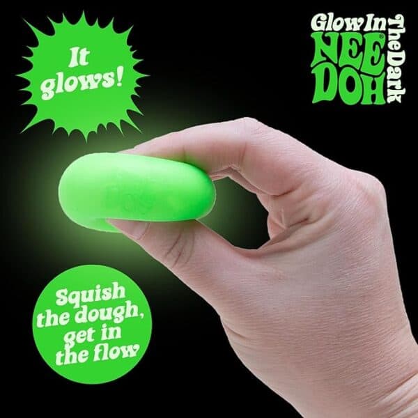 Hand holding glowing green Nee Doh dough.