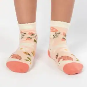 Child wearing mushroom-patterned socks