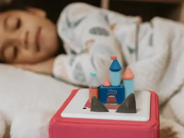 Child resting, focus on toy castle.