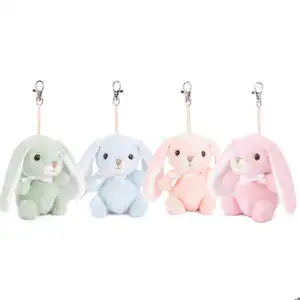 Four plush bunny keychains in pastel colors