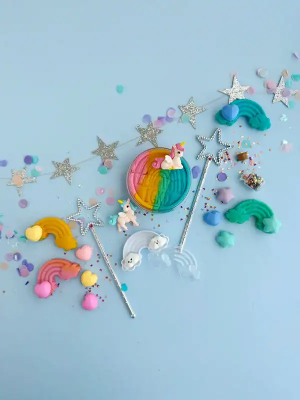 Colorful unicorn and rainbow-themed party decorations.