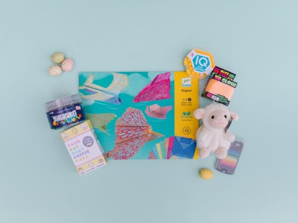 Colorful stationery, plush toy, and art supplies on display.