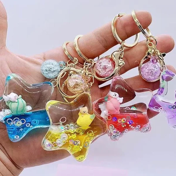 floating star animal key charm