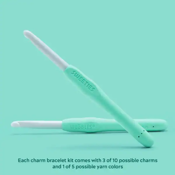 Two mint green crochet hooks.